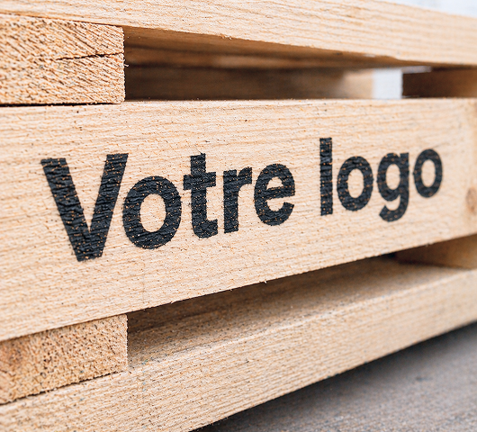 Company logo on a wooden pallet